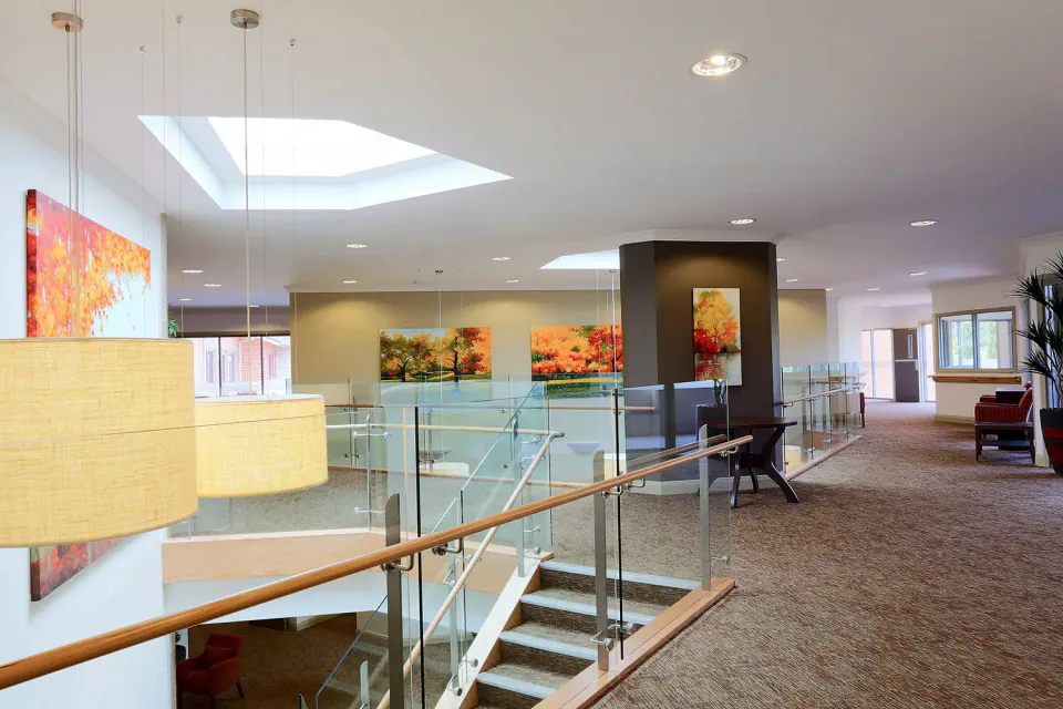 Upper floor lounge beside a staircase