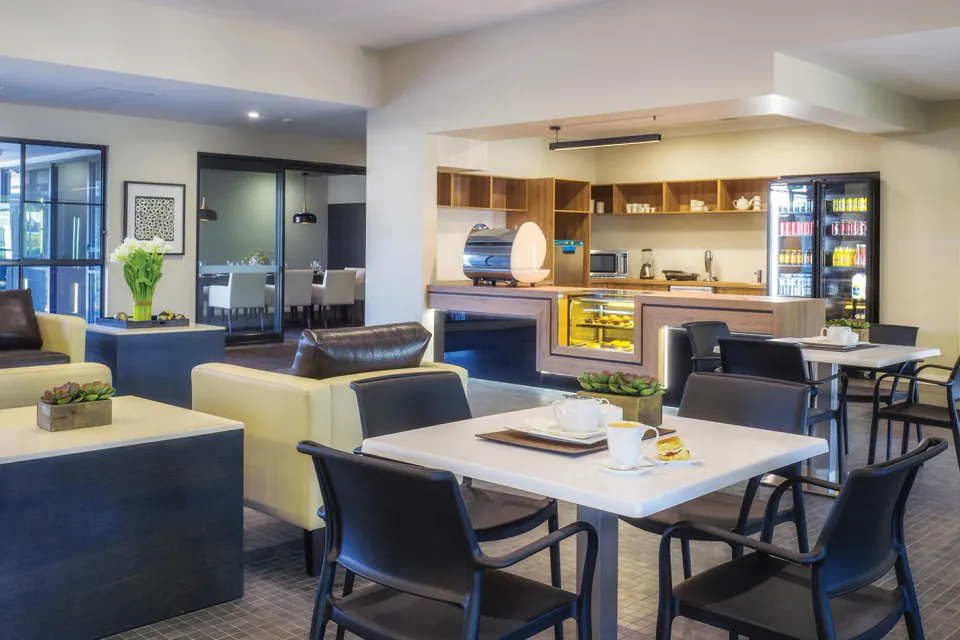 Cafe seating beside a service counter