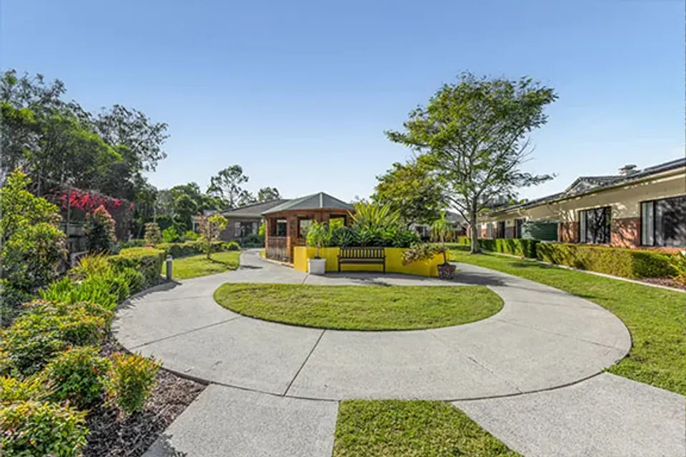 Circular garden path between residence buildings