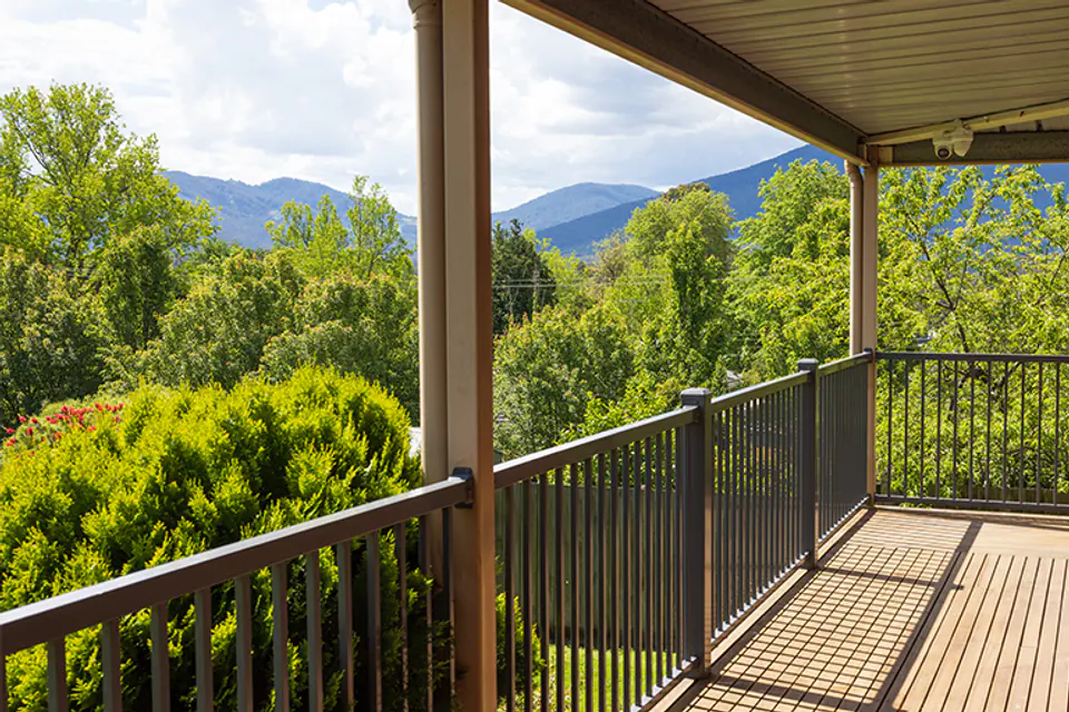 Covered balcony overlooking a green valley
